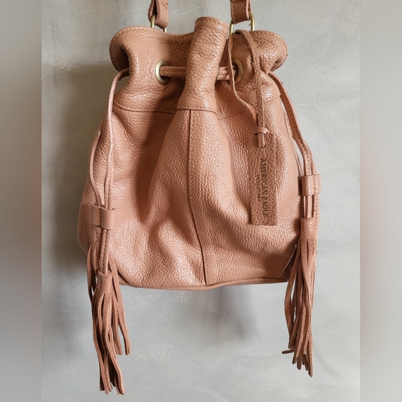 American Eagle Outfitters Handbags - American Eagle AEO Bucket Bag Leather with Tassel Pale Pink Flaw